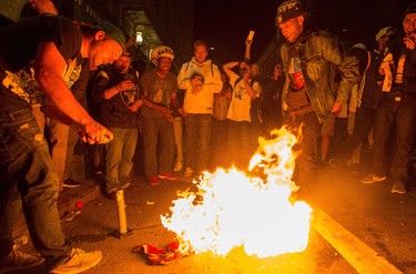 Fans light a LeBron James jersey on fire after the Golden State Warriors defeated the Cleveland Cavaliers in game 5 of the NBA Finals in Oakland, Calif., on Monday June 12, 2017. The Warriors won 129-120 to win the NBA championship. (AP Photo/Josh Edelson) ORG XMIT: CAJE106