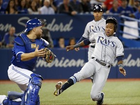 Rays Tim Beckham is tagged out at home by Russell Martin as the Blue Jays beat the Tampa Bay Rays 4-1 at the Rogers Centre in Toronto, Ont. on April 29, 2017. (Michael Peake/Toronto Sun)