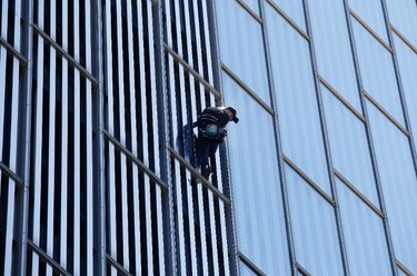 French urban climber, Alain Robert, also known as "French Spiderman", scales the 120 metres (393 ft) Melia Barcelona Sky Hotel in Barcelona, Spain, Monday, June 12, 2017. (AP Photo/Manu Fernandez)