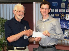 Great Lakes Secondary School student Sebastien Sheldon accepts his $1,000 Golden K Kiwanis Key Club scholarship from Kiwanis member Fern Noel on June 6.
CARL HNATYSHYN/SARNIA THIS WEEK