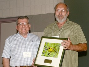 Larry Cornelis, right, receives the Ontario Nature Achievement Award from Otto Peter, of Ontario Nature.
Handout/Sarnia This Week