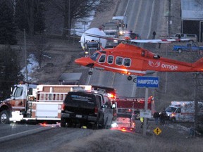 An Ornge air ambulance touches down in Hampstead, near Stratford, in the fallout of a crash at an intersection between a truck and a van packed with migrant workers on Feb, 6, 2012, that left 11 men dead. (Postmedia News file photo )