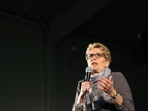 According to Premier Kathleen Wynne, her government can now afford to offer bigger wage increases than previous agreements because the province’s budget is balanced. (POSTMEDIA NETWORK/FILES)