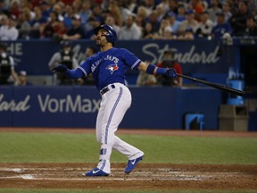 Toronto Blue Jays Devon Travis 2B (29) watches his two-run home run take off in the seventh inning in Toronto, Ont. on Wednesday May 31, 2017. (Jack Boland/Toronto Sun/Postmedia Network)