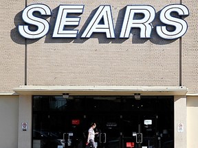 A shopper walk past the entrance to the Sears Canada store at the Lansdowne Place mall in Peterborough, Ont. on Tuesday, June 13, 2017. Sears issued the most dire warning yet about its future on Tuesday. Clifford Skarstedt/Peterborough Examiner/Postmedia Network