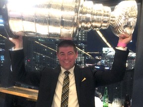 Casey Torres of Kingston, a scout with the National Hockey League’s Pittsburgh Penguins, hoists the Stanley Cup at a celebration after the Pens won Game 6 to take the best-of-seven Stanley Cup final over the Nashville Predators, 4-2. (Supplied Photo)