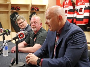 Ottawa 67's GM James Boyd, left, governor Jeff Hunt, V.P. of hockey ops/coach André Touringny on June 13, 2017. (Jean Levac/Postmedia)