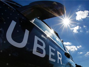 In this Sept. 12, 2016, file photo, a self-driving Uber sits ready to take journalists for a ride during a media preview in Pittsburgh. Uber CEO Travis Kalanick will take a leave of absence for an unspecified period. (AP Photo/Gene J. Puskar)