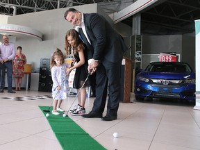 Vince Palladino, president of Palladino Auto Group, along with his daughter Ella and Stella Carrier, putt at a press conference kicking off the Palladino Auto Group Golf Classic for NEO Kids in Sudbury on Tuesday. The tournament which raised $120,000 last year is sold out, but NEO Kids is seeking volunteers to hep out and sponsorship opportunities are still available. The event this year takes place July 27 at the Idywylde Golf and Country Club. For more information, email neokidsfoundation@hsnsudbury.ca.