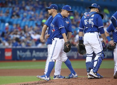 TORONTO, ON - JUNE 13: Marco Estrada #25 of the Toronto Blue Jays exits the game as he is relieved by manager John Gibbons #5 in the fourth inning during MLB game action against the Tampa Bay Rays at Rogers Centre on June 13, 2017 in Toronto, Canada. (Photo by Tom Szczerbowski/Getty Images)