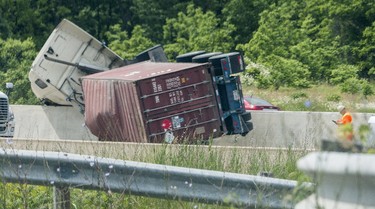 A rolled over transport truck caused major traffic headaches after both directions of the QEW highway were closed down Tuesday June 13 2017 just west of Martindale Rd. in St. Catharines.  Police evacuated a large area due to a potential hazardous gas the transport was carrying.  Bob Tymczyszyn/St. Catharines Standard/Postmedia Network