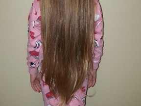 Sophie Hoag, a kindergarten student at Ecole publique Foyer-Jeunesse, will have her long hair cut off in support of the NEO Kids Foundation. Supplied photo