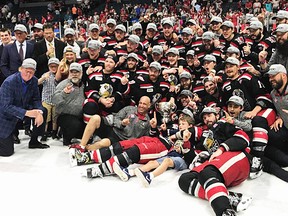 Former Belleville Bulls captains Dan Cleary (front row, third from left) and Eric Tangradi (front row, far right) celebrate with their Grand Rapids Griffins teammates after capturing the AHL Calder Cup title Tuesday night in Grand Rapids. (AHL.com photo)