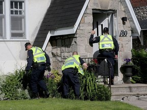 Ottawa police look for evidence and talk to homeowners near a shooting which took place in near Rosemere and Springhurst avenues in Old Ottawa East at about 1 a.m. June 14, 2017. Tony Caldwell, Postmedia