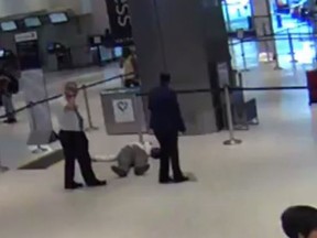 Airport surveillance video shows a United Airlines worker pushing a 71-year-old passenger to the ground. (Screengrab/KPRC Video)