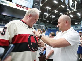 Cory Stillman, new Sudbury Wolves head coach signs a jersey for Theo Reed at a fan appreciation event in Sudbury, Ont. on Tuesday June 13, 2017. The event featured a question-and-answer period with Cory Stillman, and a few words from Sudbury Spartans head coach Junior Labrosse, and video excerpts of Wolves eagerly anticipating the NHL entry Draft playing on the score board. Dario Zulich will also be speaking aboutthe future of SWSE and the sports and entertainment landscape in Greater Sudbury. Gino Donato/Sudbury Star/Postmedia Network