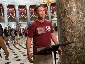 Rep. Rodney Davis, R-Ill., still wearing his baseball shirt, describes for reporters on Capitol Hill in Washington, Wednesday, June 14, 2017, the scene at a congressional baseball practice in Alexandria, Va., earlier where a gunman opened fire wounding House Majority Whip Steve Scalise, R-La. during a Congressional baseball practice. (AP Photo/J. Scott Applewhite)