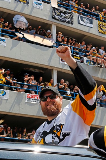 Pittsburgh Penguins' Phil Kessel rides in the Stanley Cup victory parade in Pittsburgh, Wednesday, June 14, 2017. (AP Photo/Gene J. Puskar)