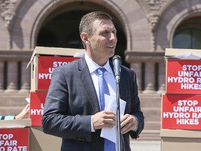 Ontario PC Leader Patrick Brown holds a press conference on the lawn of Queen's Park on Wednesday, June 14, 2017. Behind him are thousands of letters from Ontarians opposing hydro rate hikes. (VERONICA HENRI/TORONTO SUN)