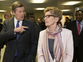 Toronto Mayor John Tory needs Ontario Premier Kathleen Wynne to pony up so the city can get much-needed federal funding for housing and transit. (STAN BEHAL/TORONTO SUN FILES)