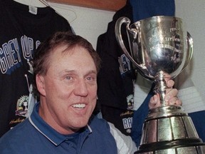 Baltimore Stallions coach Don Matthews poses with the Grey Cup following his team's 37-20 championship victory over the Calgary Stampeders in Regina in 1995. (THE CANADIAN PRESS/Tom Hanson)