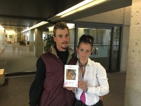 John and Desiree Knoll pose with a picture of their daughter Nevaeh Michaud who died in an Edmonton group home in 2014 on Monday, June 12, 2017. The parents were at Edmonton's Provincial Courts attending the fatality inquiry into their daughter's death from an overdose of a sleep aid while in care.