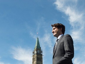 Canadian Prime Minister Justin Trudeau leaves the stage after a flag-raising ceremony on Parliament Hill in Ottawa on Wednesday, June 14, 2017. (THE CANADIAN PRESS/PHOTO)
