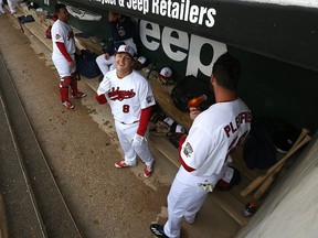 Winnipeg Goldeyes 2B Mason Katz (centre) laughs as 1B Shawn Pleffner uses a hair dryer for keeping hands warm on his beard during American Association action against the Sioux Falls Canaries at Shaw Park in Winnipeg on Mon., May 29, 2017. Kevin King/Winnipeg Sun/Postmedia Network