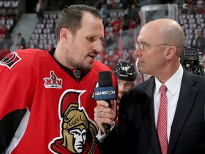 Dion Phaneuf of the Ottawa Senators talks with broadcaster Pierre McGuire prior to Game 6 of the Eastern Conference Final against the Pittsburgh Penguins during the NHL playoffs at Canadian Tire Centre on May 23, 2017. (Jana Chytilova/Freestyle Photo/Getty Images)