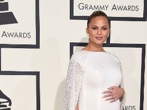 Model Chrissy Teigen arrives on the red carpet during the 58th Annual Grammy Music Awards in Los Angeles February 15, 2016. (Valerie Macon/AFP/Getty Images)