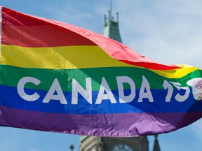 The Canada 150 pride flag flies on Parliament Hill following a ceremony with Prime Minister Justin Trudeau in Ottawa, Wednesday June 14, 2017. (THE CANADIAN PRESS/Adrian Wyld)
