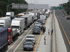 Westbound traffic on Highway 402 is shown backed up from the Christina Street overpass in Sarnia Thursday. The westbound span of the Blue Water Bridge was closed for several hours. Tyler Kula/Sarnia Observer/Postmedia Network
