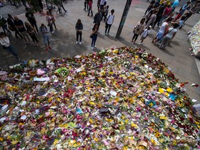 Chris J Ratcliffe/Getty Images
Flowers are laid by members of the public in tribute to the victims of the Borough terror attack on the south side of London Bridge near Borough Market on June 11 in London, England. After the terror attack on June 3, when eight people were killed, the area around Borough market is beginning to reopen as people return to leave flowers, messages and visit local businesses.