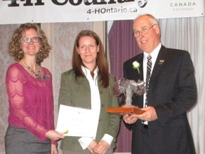 Long-time west Elgin 4-H leader Ken McCallum, right, was one of three Ontario leaders recognized this year by the organization. He is joined by Debra Brown, left, 4-H Ontario executive director, and Claire Wooding, representing award sponsor Syngenta. (Contributed Photo)