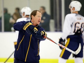 In this Sept. 18, 2015, file photo, Nashville Predators assistant coach Phil Housley instructs players at NHL hockey training camp in Nashville, Tenn. (AP Photo/Mark Humphrey, File)