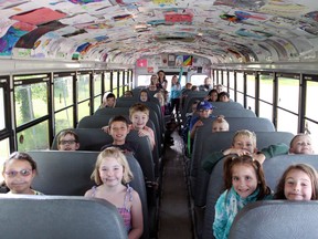 Brookwood students who ride Bus Bentley to school each day have contributed more than 300 pieces of original artwork to the bus, lining its ceiling to create a mobile art show. - Photo by Jesse Cole Reporter/Examiner