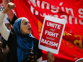 A woman shouts slogans as people march in support of the Muslim community as activists take part in the 'March Against Sharia' at Foley Square on June 10 in New York City. Marches nationwide were organized by the conservative organization ACT for America, which was protesting against elements of Sharia Law that the group believes are increasingly showing up in American society. (Eduardo Munoz Alvarez/Getty Images)