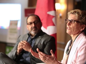 Premier Kathleen Wynne talks at the Greater Sudbury Chamber of Commerce fireside chat as MPP Glenn Thibeault looks on in Sudbury, Ont. on Tuesday May 23, 2017. (Gino Donato/Postmedia Network)
