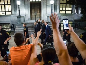 Bill Cosby waves to people calling out to him as he walks from the Montgomery County Courthouse during his sexual assault trial in Norristown, Pa., Thursday, June 15, 2017. (AP Photo/Matt Rourke)