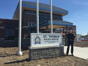 Acting police Chief Chris Herridge proudly stands outside the department's new headquarters at 45 CASO Crossing Friday, its first operational day. (Jennifer Bieman/Times-Journal)