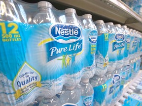 Nestle Pure Life water is pictured in this file photo on a shelf at a grocery store in North Vancouver, B.C. Nestle Water is one of the partners in the NaturALL Bottle Alliance with California-based Origin Materials, a company planning to build a bio-chemical commercial scale demonstration plant in Sarnia. ( THE CANADIAN PRESS/Jonathan Hayward)