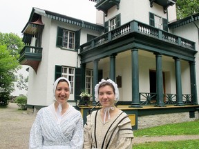Costumed Bellevue House tour guides Edana Pelliccione (Left) and Andrea Howard (Right) in front of the historic Bellevue House in advance of Saturday’s Doors Open Kingston event on Friday June 17th 2017. (Ashley Rhamey/Kingston Whig-Standard/Postmedia Network) .