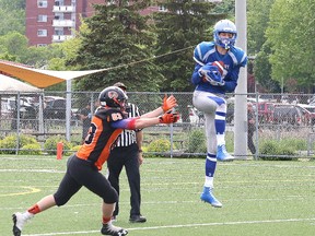 Riley Roy, right, of the Sudbury varsity Gladiators, picks off a pass during football action against the Peterborough Wolverines at James Jerome Sports Complex in Sudbury, Ont. on Saturday June 10, 2017. John Lappa/Sudbury Star/Postmedia Network