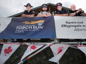 Left to right: Provincial Sheriff Geoff Campbell, Peace Officer Steve Schmidt, EPS Cst. Tim Connell and Paramedic Mark Carson have begun a 53-hour camp out on the roof of the south Edmonton Cabela's store as a fundraiser for Special Olympics Aberta, in Edmonton Friday June 16, 2017.
