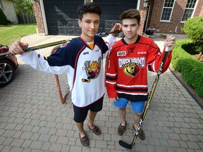 MORRIS LAMONT/THE LONDON FREE PRESS 
Ryan Suzuki, left, and his older brother Nick both collected a major junior award last week at Toronto?s Hockey Hall of Fame. Ryan was the first overall pick in this year?s OHL draft, and Nick is slated to be selected by in the first round of the NHL draft in Chicago, Ill., on Friday.