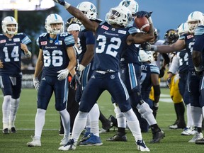 Toronto Argonauts running back James Wilder Jr. celebrates his touchdown during the first-half of CFL football action against the Hamilton Tiger-Cats in Hamilton on June 16, 2017. (THE CANADIAN PRESS/Peter Power)