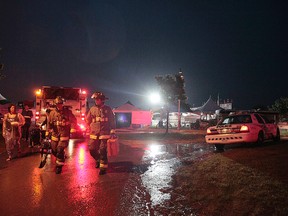 Two men were rushed to hospital after a light standard fell onto them in high winds during the Beaches Ribfest at Woodbine Park on Friday, June 16, 2017. (photo by John Hanley)