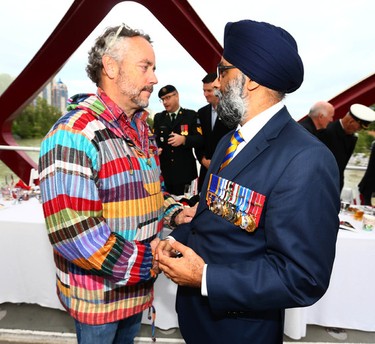 Canadian Defence Minister Hon. Harjit Singh Sajjan (L) is greeted by businessman and philanthropost W. Brett Wilson during the third annual Breakfast on the Bridge event  on Saturday June 17, 2017 in Calgary. The event takes place every two years, at sunrise, rain or shine, on the Peace Bridge and raises funds and awareness for the Calgary Military Family Resource Centre. Jim Wells//Postmedia