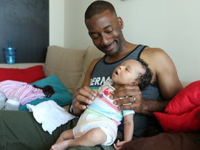 Daren Herbert, a 41-year-old Toronto dad was diagnosed with male infertility and he and his wife tried to have a child since 2008. He received funding through IVF cycle through the Ontario Fertility Program and his wife Joanne and himself welcomed baby Ori into the world in early May of this year. Friday June 16, 2017. (Jack Boland/Toronto Sun)