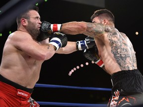 Tim Hague (left) has died after his boxing match against Adam Braidwood at the Shaw Conference Centre on Friday, June 17, 2017. (Ed Kaiser/Edmonton Sun)